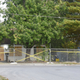 Police tape blocks off the Excelsior Springs residence of Timothy M. Haslett Jr., after the home was boarded up and fenced off Monday, Oct. 10, 2022, in Excelsior Springs, Mo., following a days-long execution of a search warrant at the home. Haslett was arrested Friday, Oct. 7, 2022, and is charged with first-degree rape or attempted rape, first-degree kidnapping and second-degree assault.